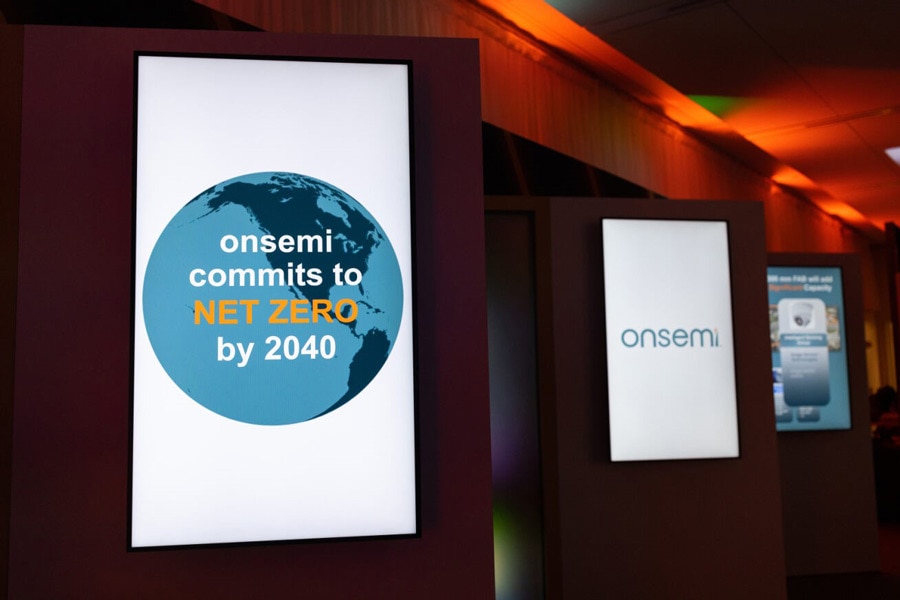 Photo of flat screen monitor showing text: onsemi commits to net zero by 2024 text